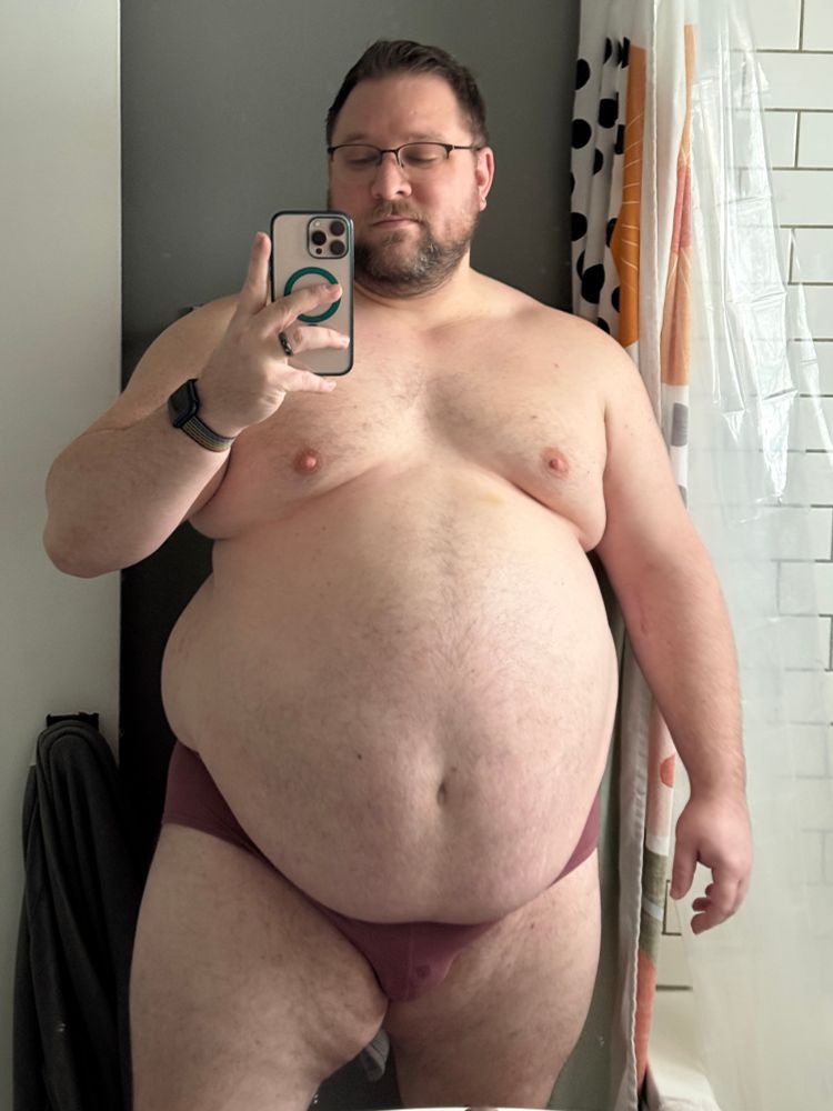 A man taking a bathroom mirror selfie 