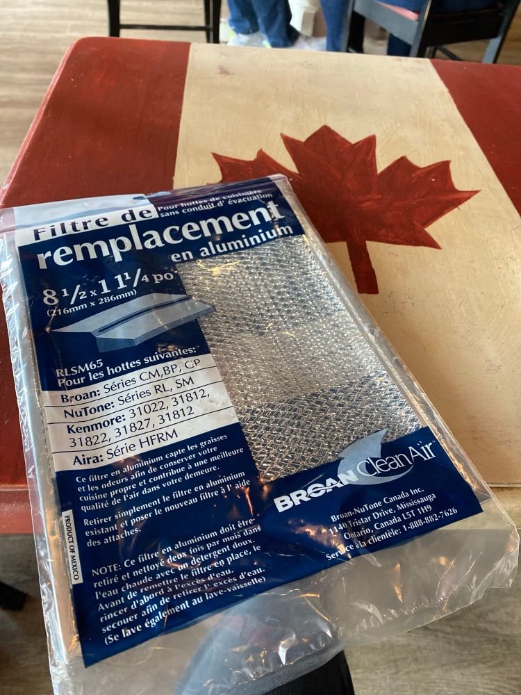 A made in Mexico filter on a table that has a Canada flag top