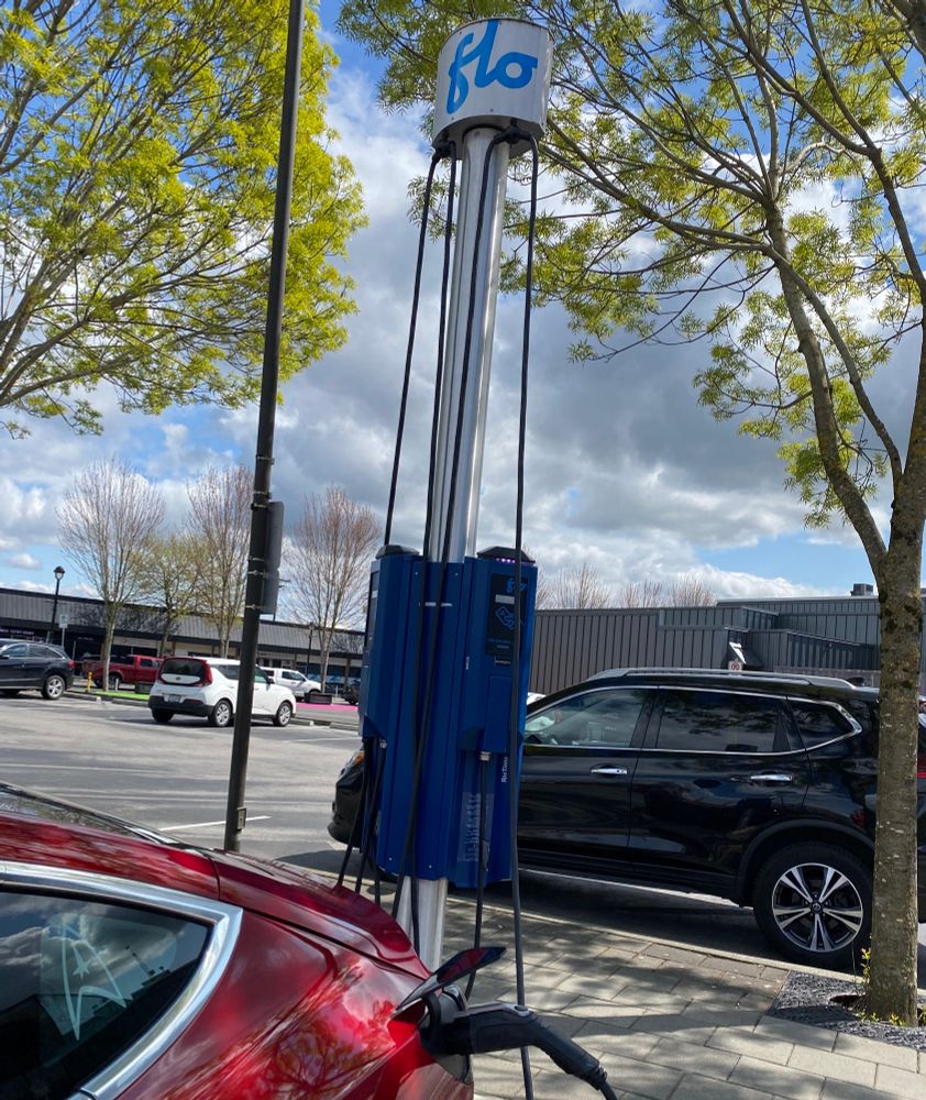 My red EV charging at a Flo EV station