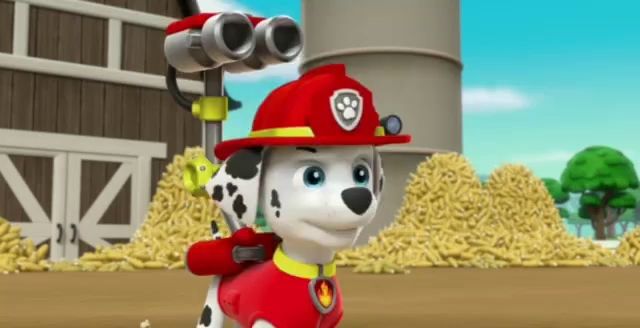 marshall from paw patrol is wearing a fireman 's hat and holding a binoculars .