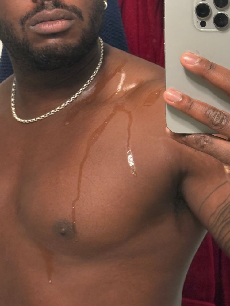 a photo of me with cum dropping from my shoulders 