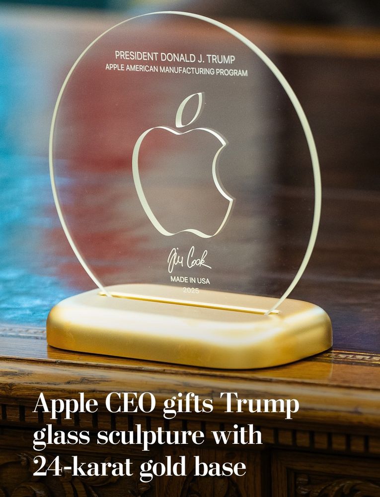 Photo from an article with the title "Apple CEO gifts Trump glass sculpture with 24-karat gold base".

The base looks like cheap Temu plastic, and the glass disc sculpture on top has the Apple logo on it and looks like an old ladies $10 night lamp

The glass sculpture features the text

PRESIDENT DONALD J. TRUMP
APPLE AMERICAN MANUFACTURING PROGRAM

The bottom has Tim Cook's signature followed by MADE IN USA, 2025.

All text is in small caps in an atrociously selected sans-serif font that's almost as embarrassing as the sucking up to a fascist administration.