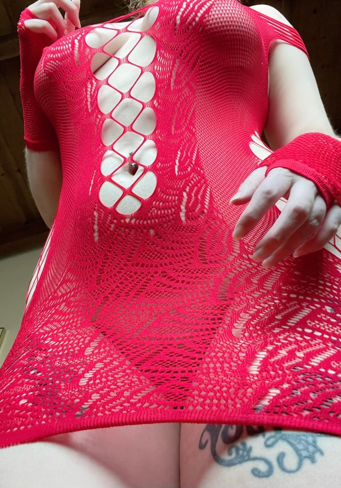 cosplaykinky torso shot in a sheer red lacy dress looming over the viewer