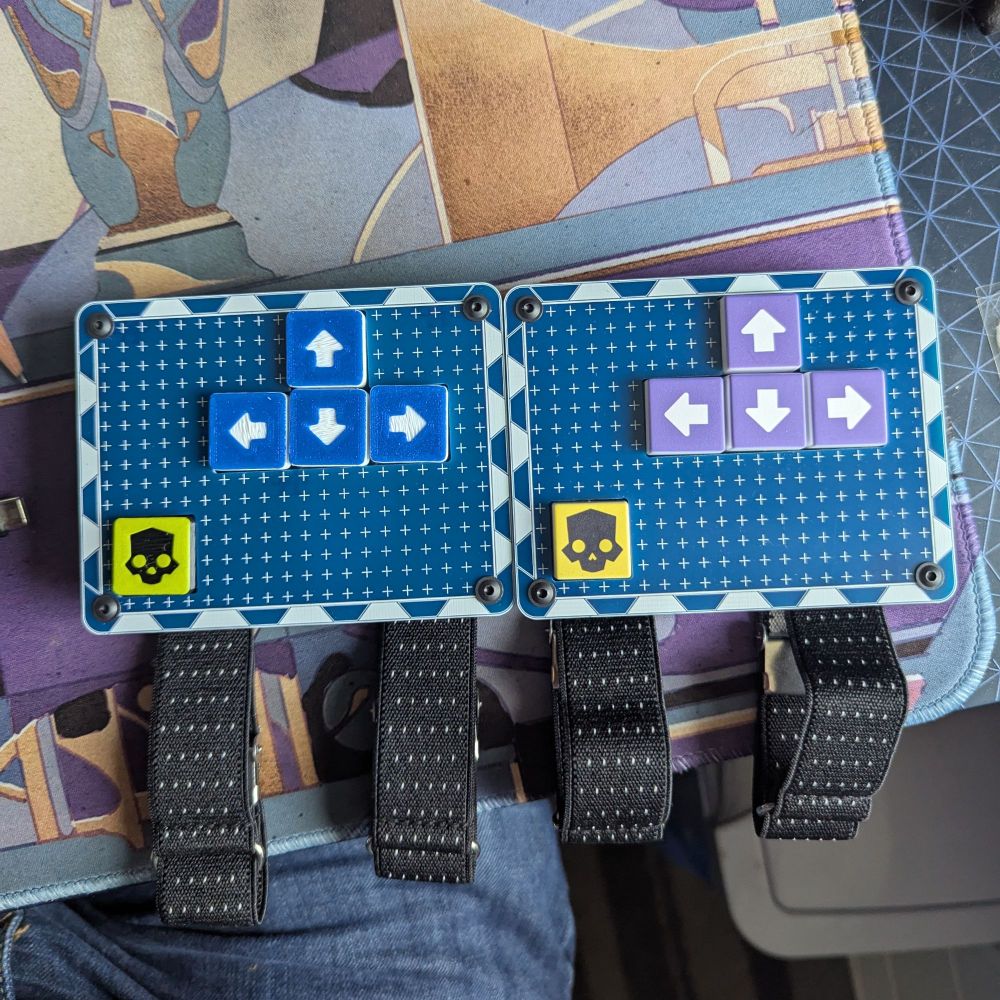 Two versions of the MatchstickWorks StrataPad for Helldivers 2. One with dye sublimation keycaps, the other with 3d printed keycaps