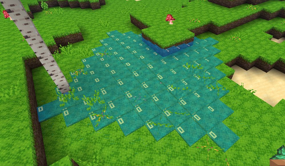 Water flowing through grass and a log