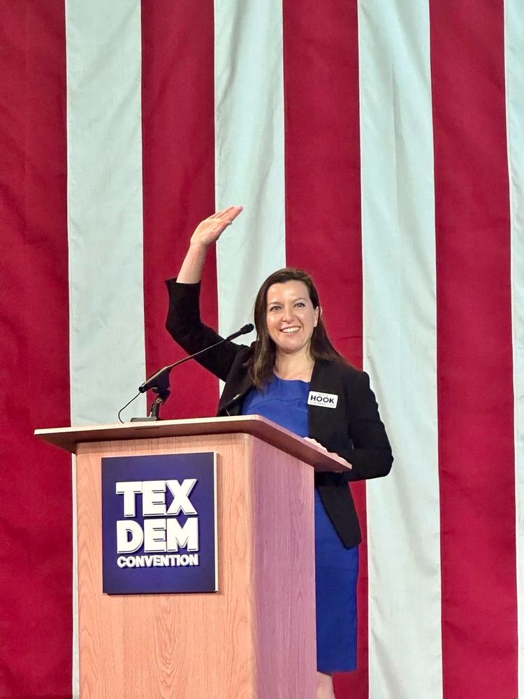 Kristin stands at a podium about to give a speech at the Texas Democratic Convention in El Paso in June 2024.