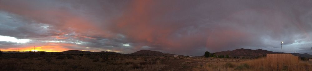 Sunset rainbow and mountains