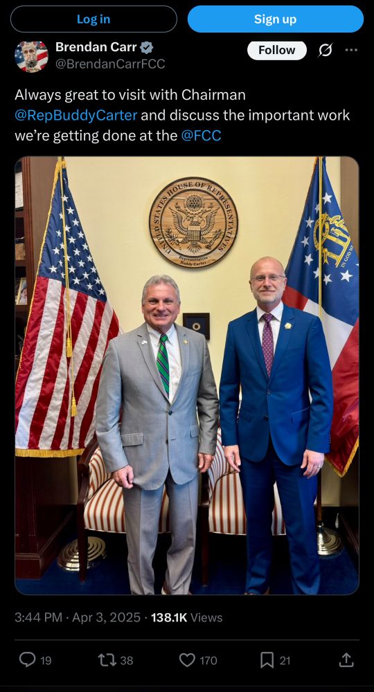 X post from @BrendanCarrFCC dated April 3,2025 “Always great to visit with chairman @RepBuddyCarter and discuss the important work. We’re getting done at the @FCC. The accompanying photo shows the two men together and Brendan Carr is wearing a goldtone lapel pen in the shape of Trump‘s face in profile. 