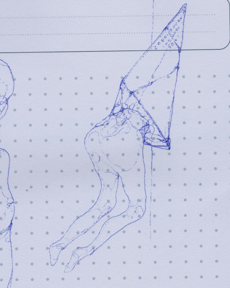Ballpoint pen of a vaguely human figure merged with a metal pyramid.