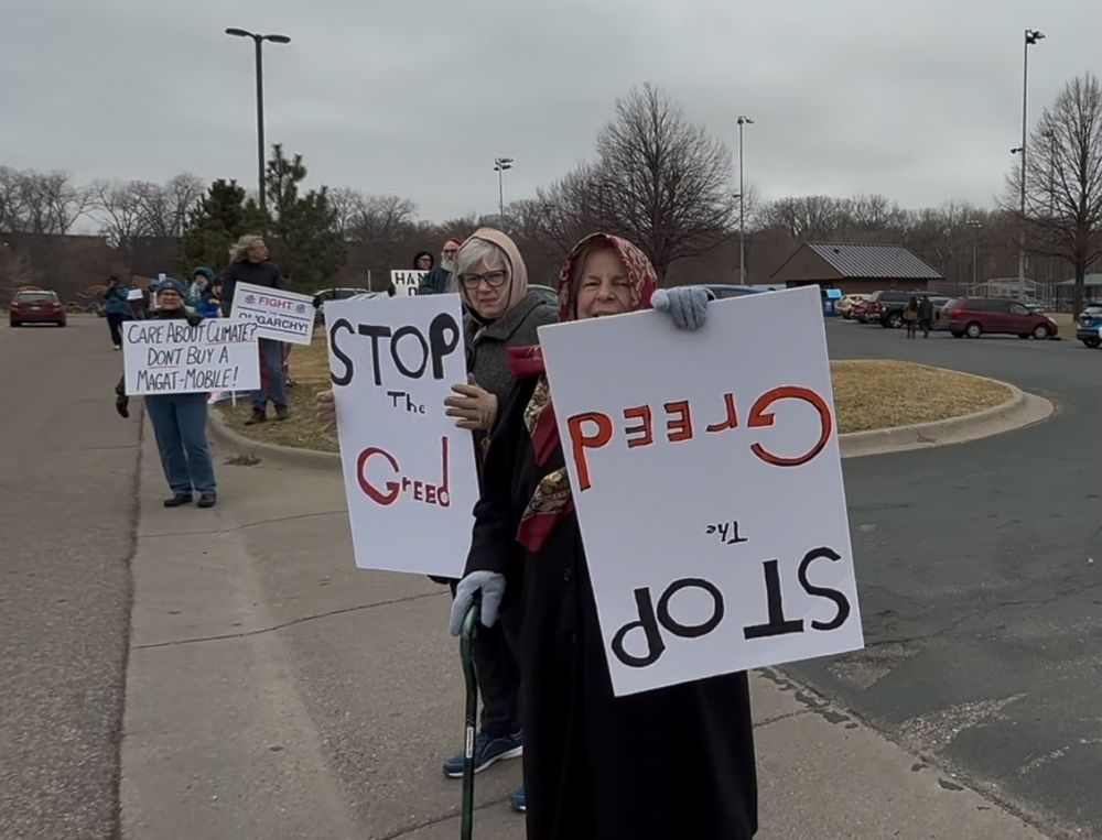 #TeslaTakedown signs … Stop the greed