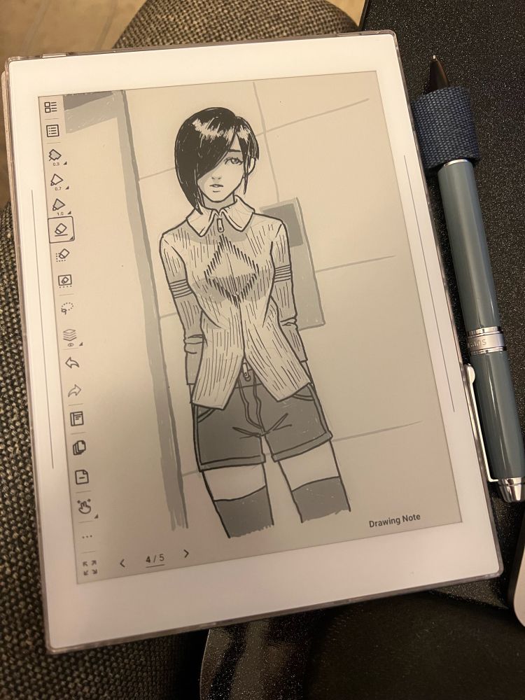A photo of the supernote device with a sketch of a woman on it.