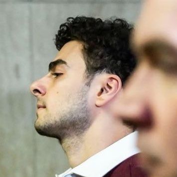 side profile of luigi mangione walking into court on December 23 2024. image from @fawngiones on twitter
