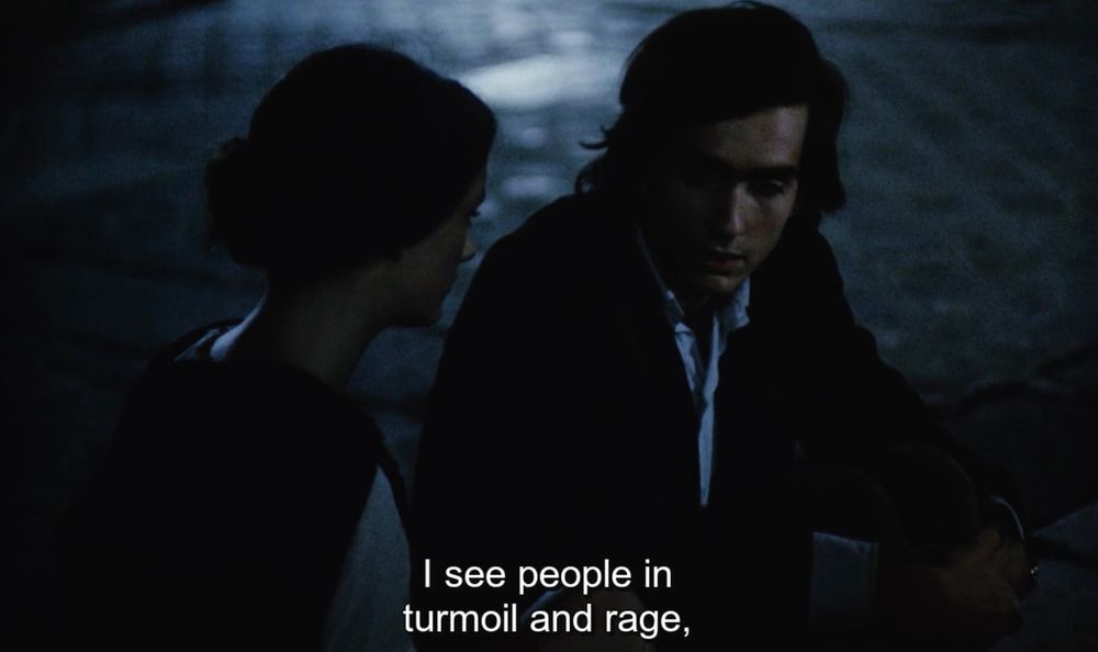 A nighttime scene from Robert Bressson's Four Nights of a Dreamer 91971) in which Jacques (Guillaume des Forêts) tells Marthe (Isabelle Weingarten) "I see people in turmoil and rage while my dream becomes flat and boring." 