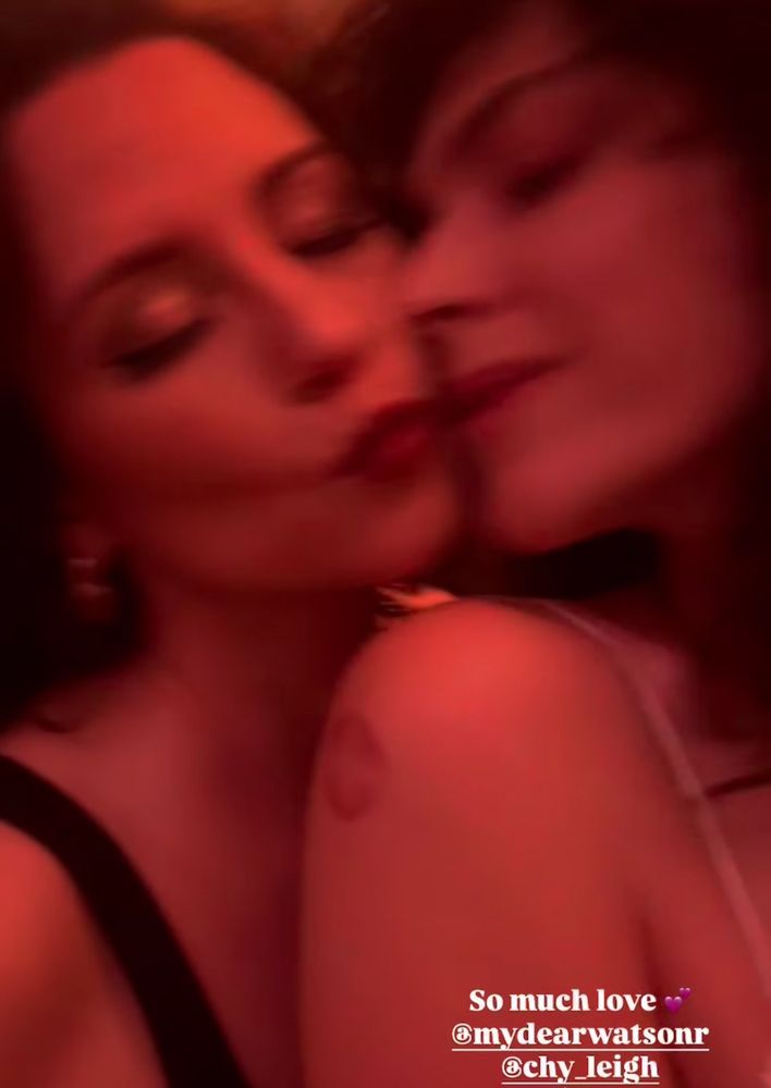 Screen grab from an IG video of Chyler Leigh kissing Watson Rose’s face 