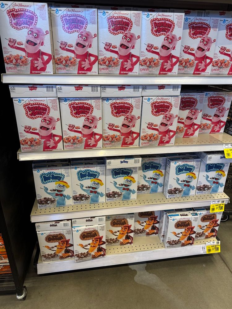Store shelf with Frankenberry, Booberry and Count Chocula breakfast cereal. 