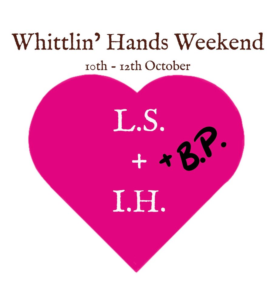 A bright pink heart with L.S. + I. H. in white lettering in the middle. Scrawled on one side in black pen is the addition of + B.P. Above are the words Whittlin’ Hands Weekend, 10th - 12th October