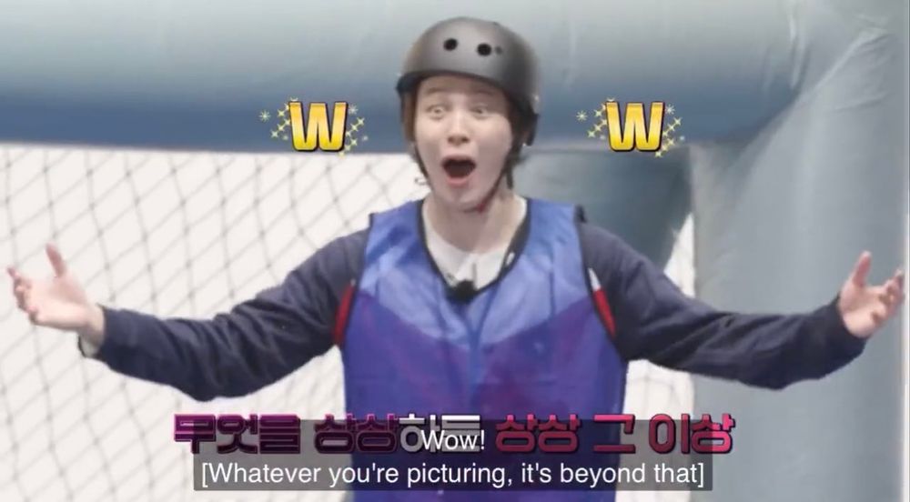 Jimin with a surprised face wearing a helmet and a waterproof jacket
Caption in image: wow! [Whatever you're picturing, it's beyond that]