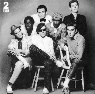Cover for The Specials single Do Nothing, featuring a black & white photograph of the band.
