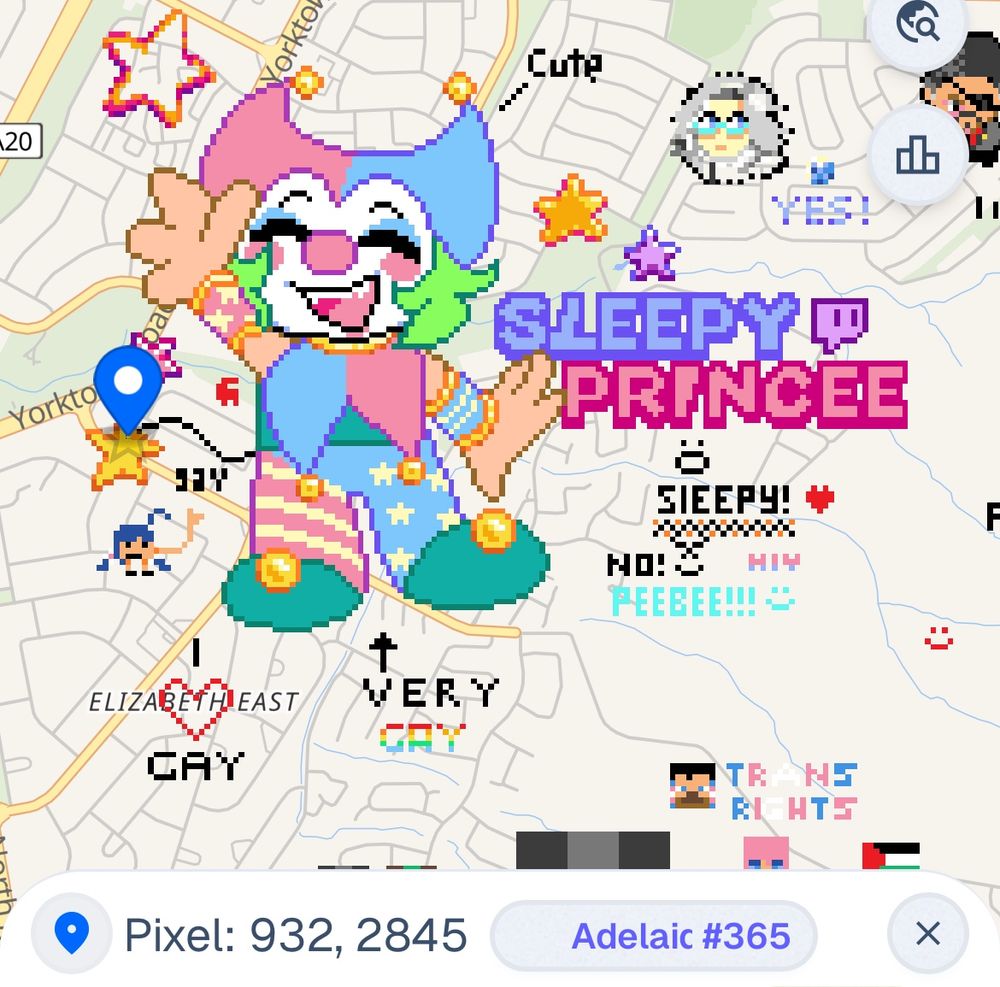 A pixel drawing of Sleepy the Clown surrounded by smaller pixel doodles on the website wPlace. 