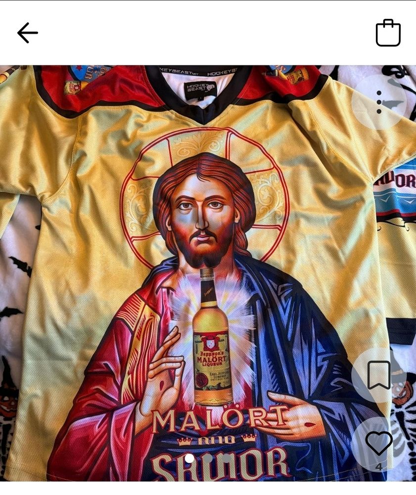 Front of the jersey featuring art of Jesus holding a bottle of malört that says "malört and savior" I think