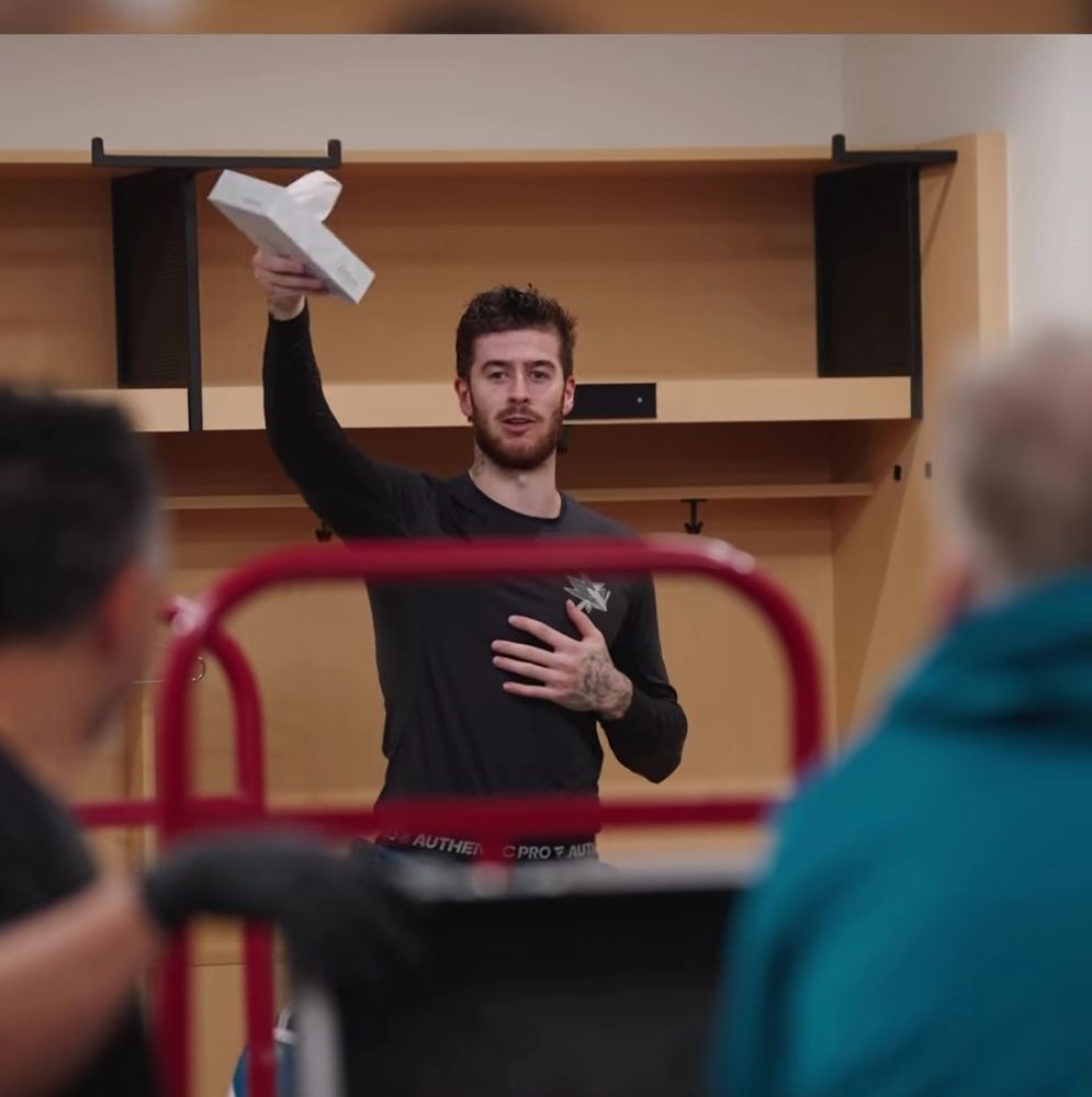 Yaroslav Askarov holding up the post win box of tissues