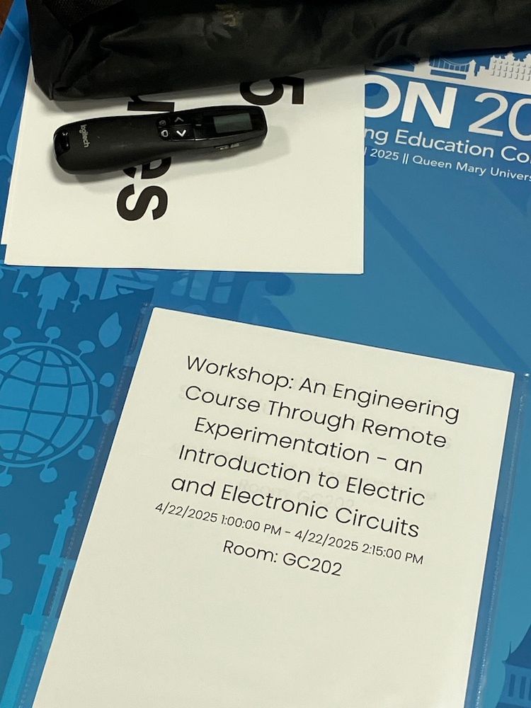 This is a large A2  posterboard in blue with the Educon 2025 colouring and logo branding etc and an A4 polypocket attached. There are several A4 pieces of paper in it and the first announces the next event in that room. Here is't room GC202 and the first event there is at 1pm and it will be a Workshop on "An engineering course through remote experimentation - an introduction to electric and electronic circuits." Once that event has finished the bit of paper is discarded and the one behind it says what the next event will be. These are positioned on a small easel outside the room. Very efficient.