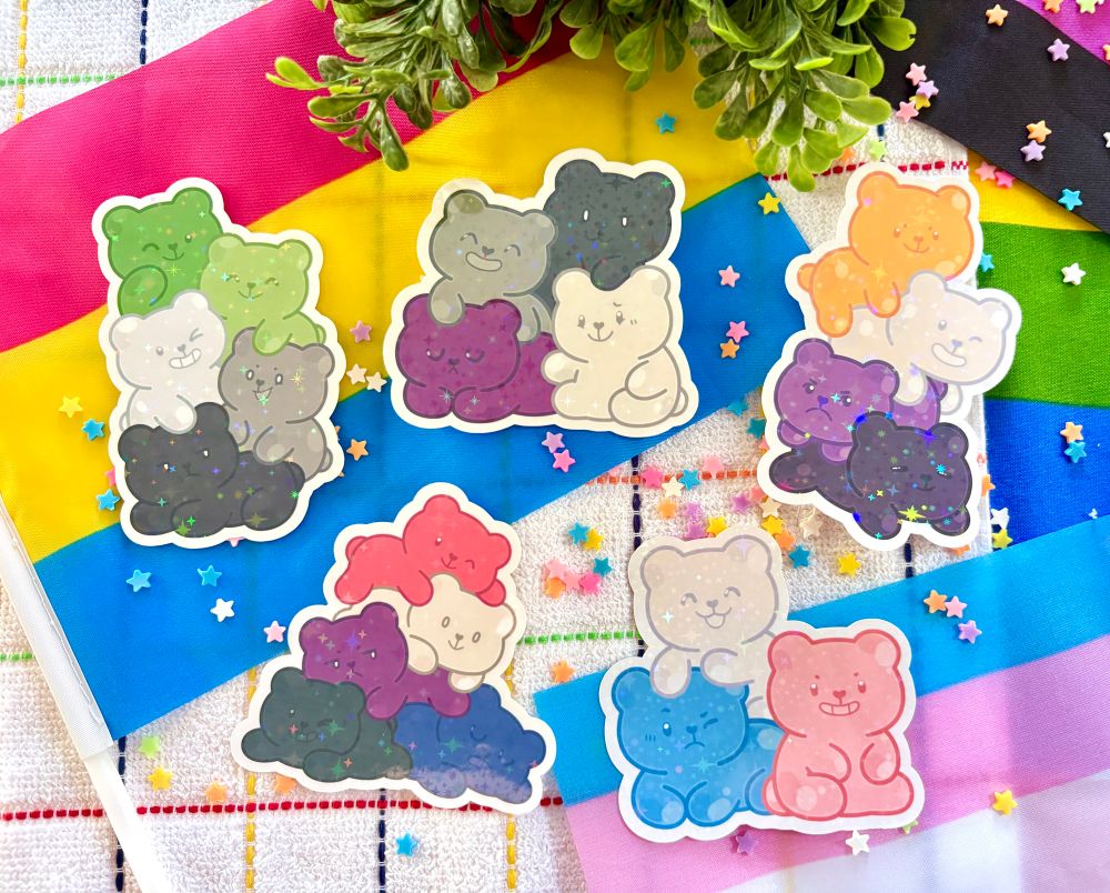 Gummy bear stickers/magnets in the aromantic, asexual, nonbinary, genderfluid, and transgender flag colors!