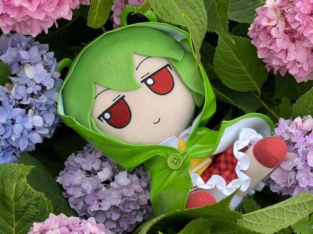 Touhou project Yuuka fumo among blue and pink hydrangea flowers 