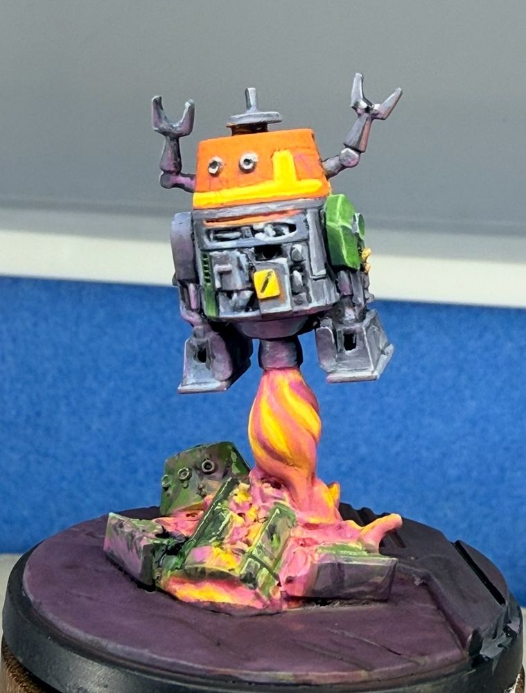 Finished miniature of chopper from star wars rebels. Colorful paints with the most blending and a colorful rocket stream.