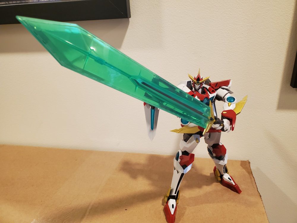 Bravern figurine in an Obari pose wielding a sword as big as he is