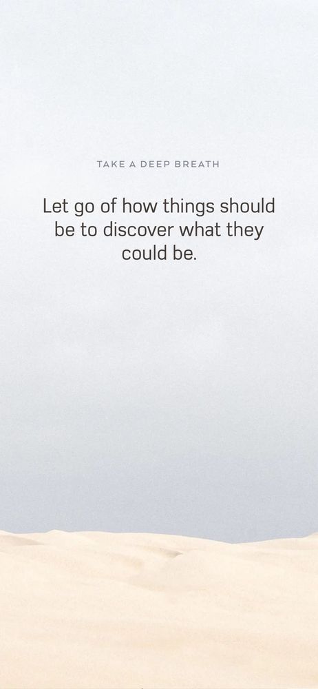 Minimalist image showing pale sand dunes under a light gray-blue sky. Text reads: “Take a deep breath. Let go of how things should be to discover what they could be.” The image evokes stillness and openness—an invitation to release control and explore discovery.
