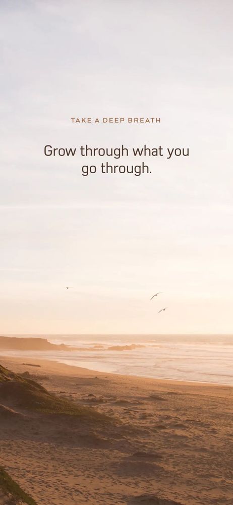 A serene beach at sunset with soft golden light illuminating the sand and waves. A few birds fly gently over the ocean. The sky is calm and pastel-toned. Centered in the sky are the words: “TAKE A DEEP BREATH — Grow through what you go through.”