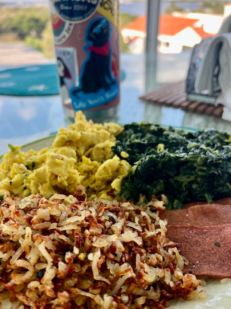 Breakfast foods, all vegan. Scrambled ‘just egg’, spinach, hash browns, and vegan bacon slices.