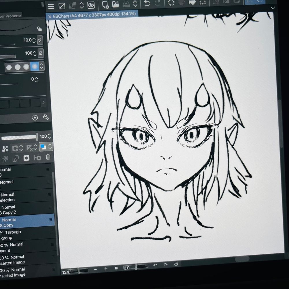 a photo of a head drawing created in clip studio, it shows a females characters head at the center with a serious expression, inked with her facial features using finer lines.