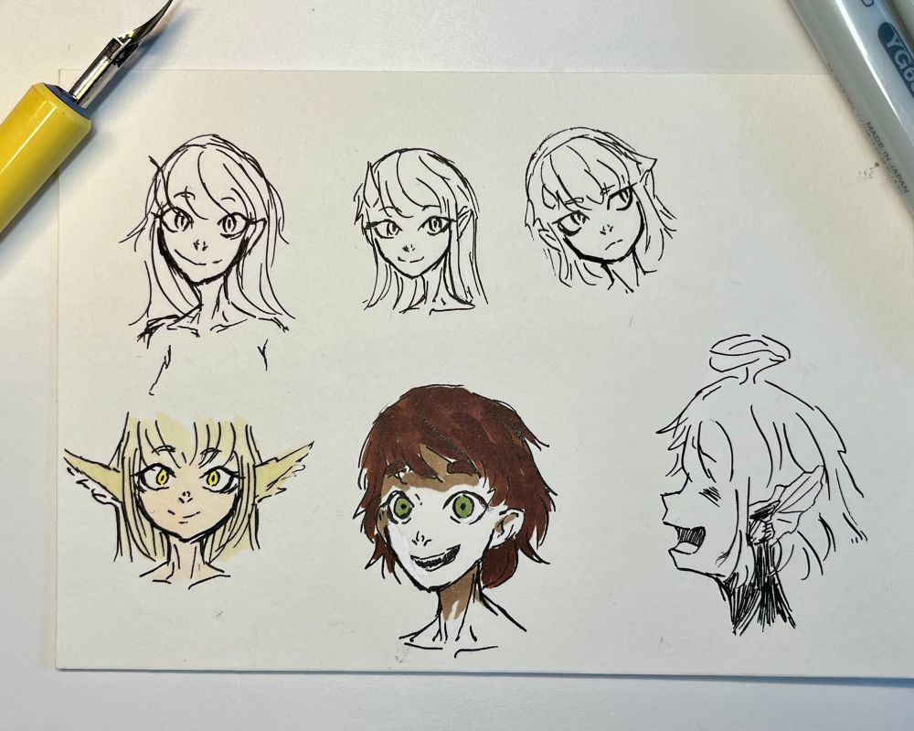 6 different drawings on heada with different expressions, 2 of those somewhat colored.