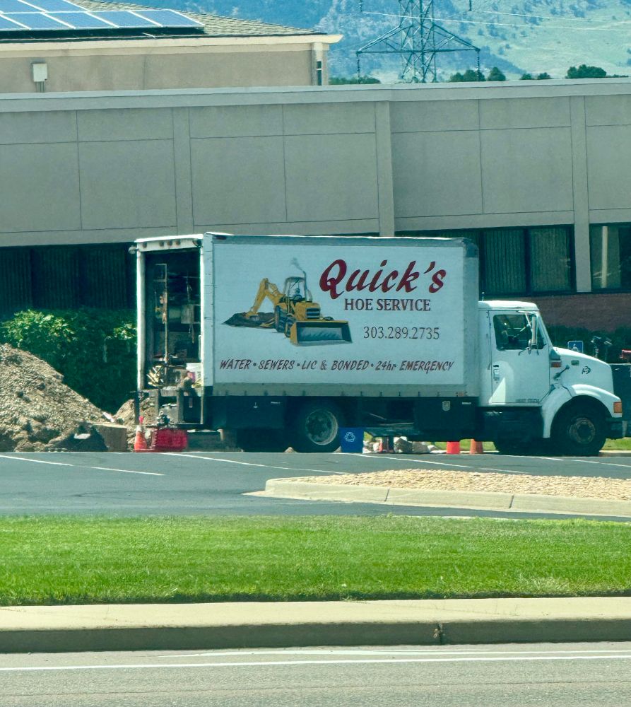Truck showing “Quick’s Hoe Service” on the side