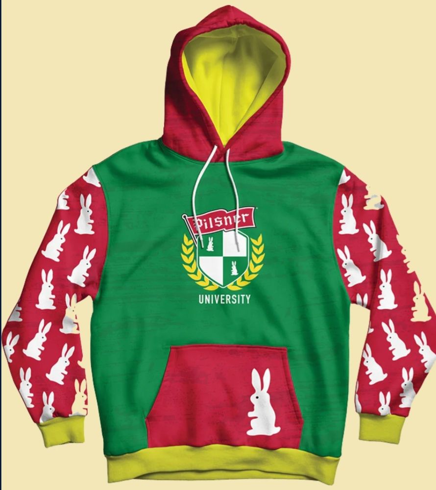 A rather colourful hoodie - green body; red sleeves, pocket, and hood; yelliw lining and trim
Crest on front says "Pilsner University" and has two bunnies. There is a bunny on the picket, and multiple bunnies on the sleeves. All the bunnies are in the style of those on the Old Style Pilsner labels. According to their FAQ, "The bunny is part of the original design on the Old Style Pilsner can, made by the daughter of the Master Brewer. According to legend there are 15 hidden throughoutthe entire design." For sale here: https://hub.quartertofive.ca/products/university-hoodie