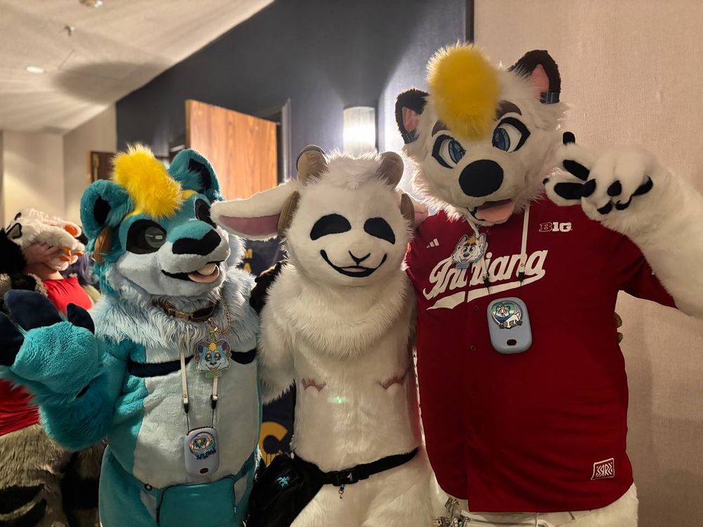 Hecc and Rainy with Raymond after the Fursuit Parade.