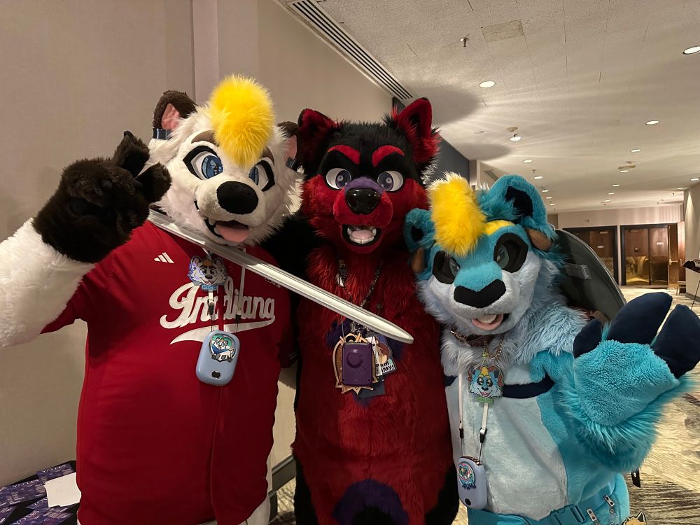 Hecc and Rainy with Wolfie after the Fursuit Parade. 