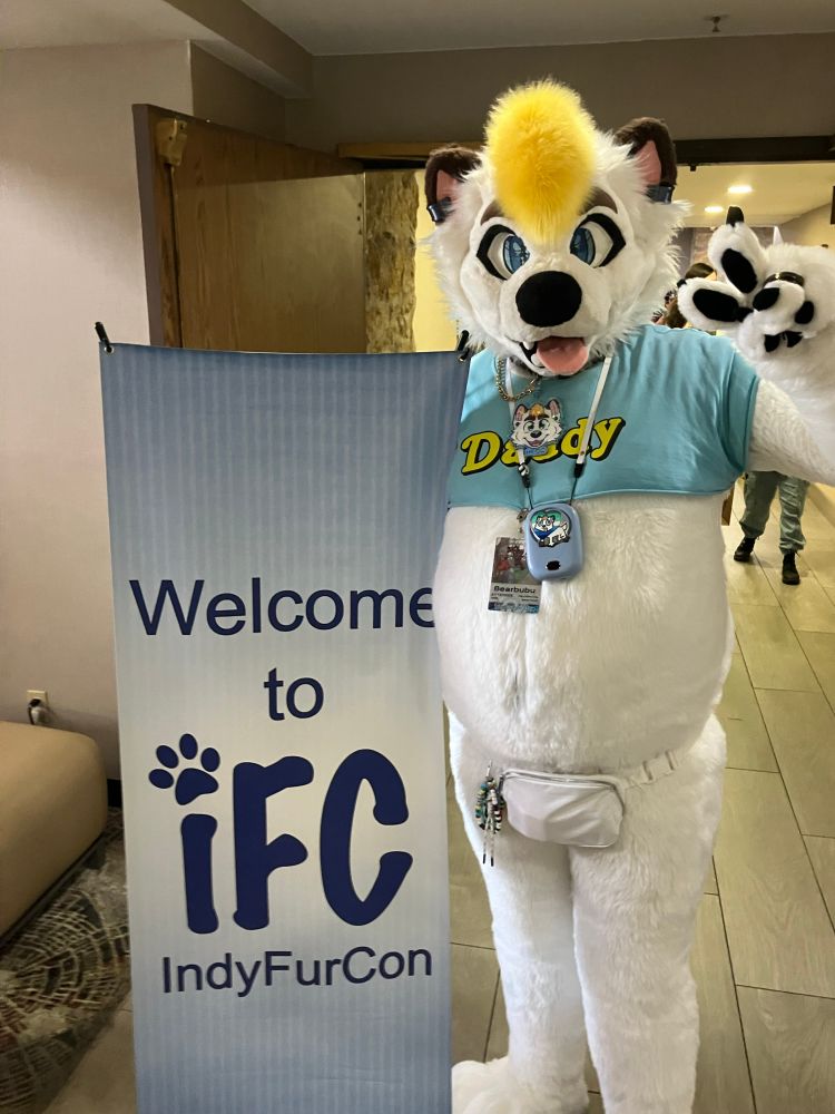 Hecc at the “Welcome to iFC” sign in the hotel lobby.