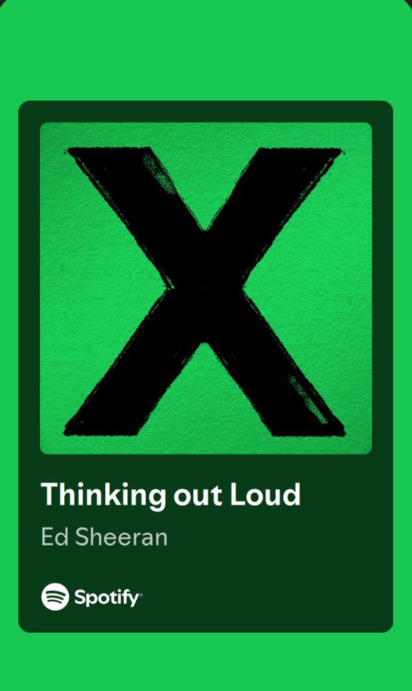 Thinking out loud by Es Sheeran . The is a black X in the middle and around it its painted green