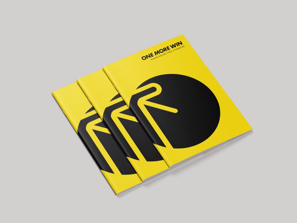 A mockup of three copies of One More Win: Ridge Racer Type 4 Fanzine on a white surface.