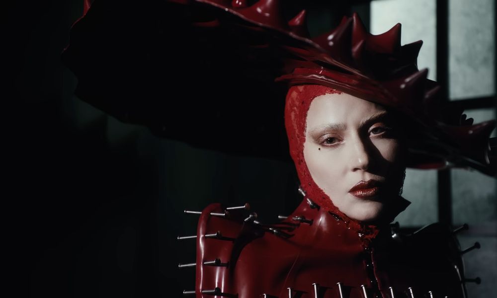 Screen capture of Lady Gaga's music video Abracadabra, Gaga as "Lady in Red"