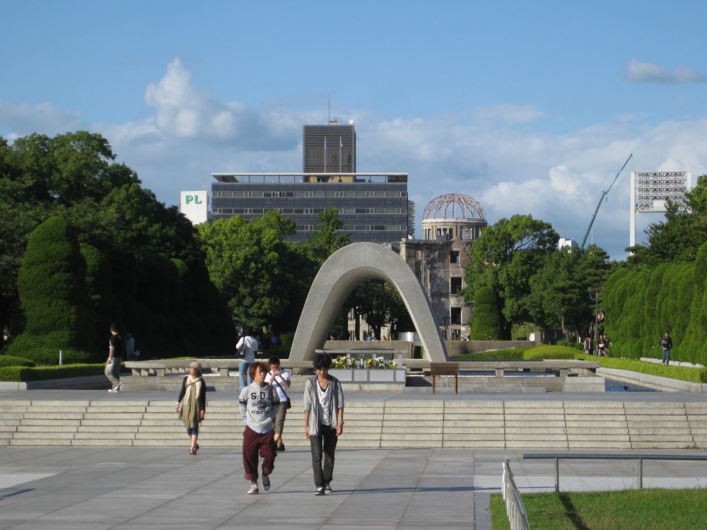 The Hiroshima Memorial Cenotaph with A-Bomb Dome in the background.