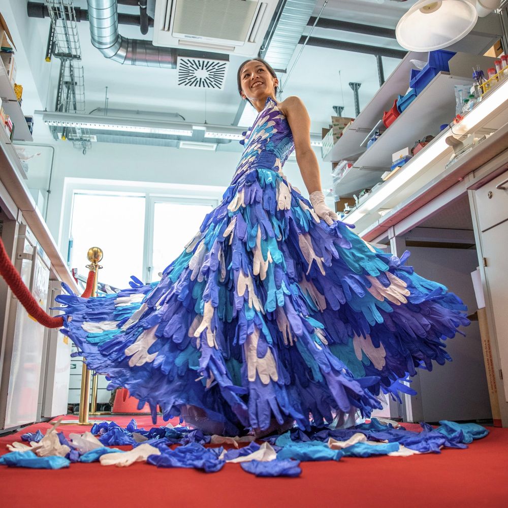 Saki the Artist wearing a ball gown made of upcycled nitrile gloves. Photo: Jürgen Hofmann