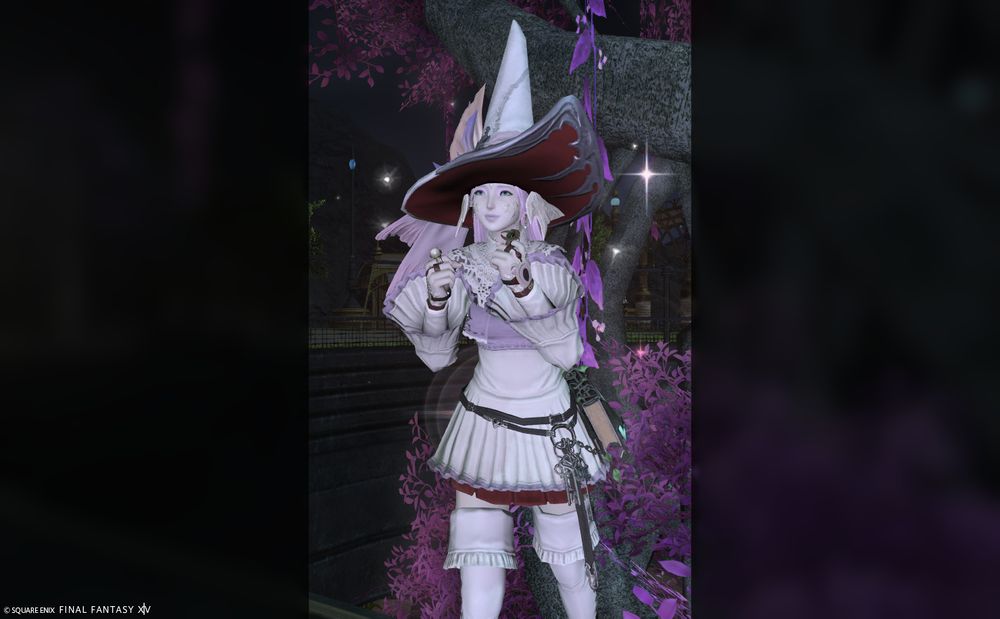 Thalia with the *Wow* emote under a pink tree