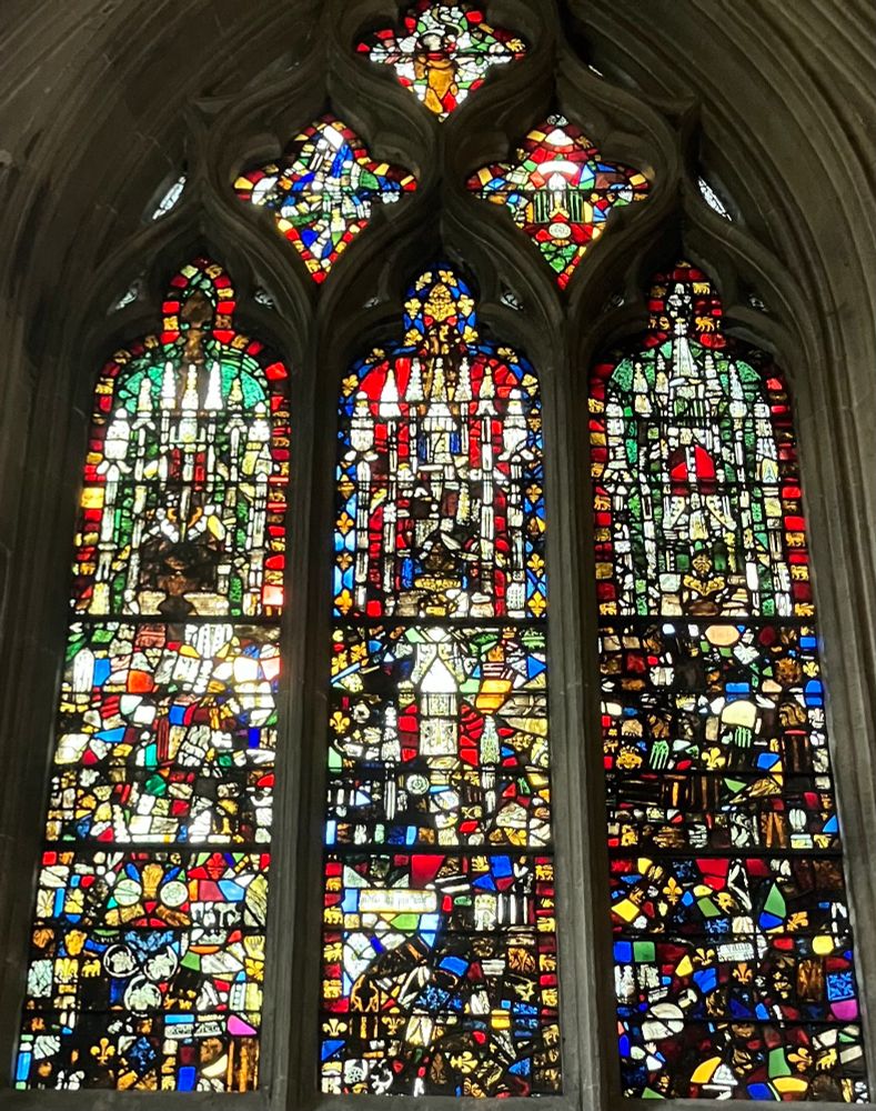A jumble of stained glass fragments forming abstract patterns in a window in a side chapel at Wells Cathedral.