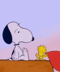 Woodstock slaps a Valentine's Day heart on Snoopy's nose.