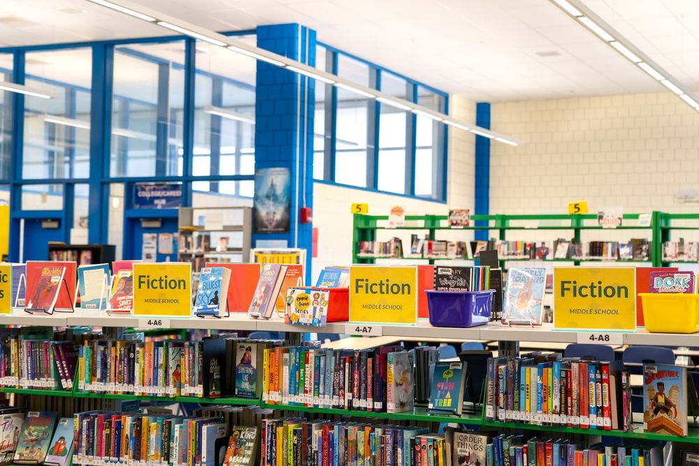 A shelf of fiction books at the Charlestown High School Library