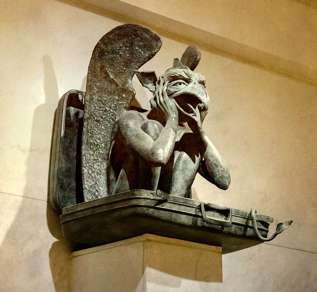 a photo of one of the gargoyle statues at the denver airport